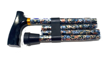 The Allied Medical Floral Foldable Cane, featuring a comfort T-handle, rubber tip, vibrant floral shaft, and black strap, is shown against a plain white background.
